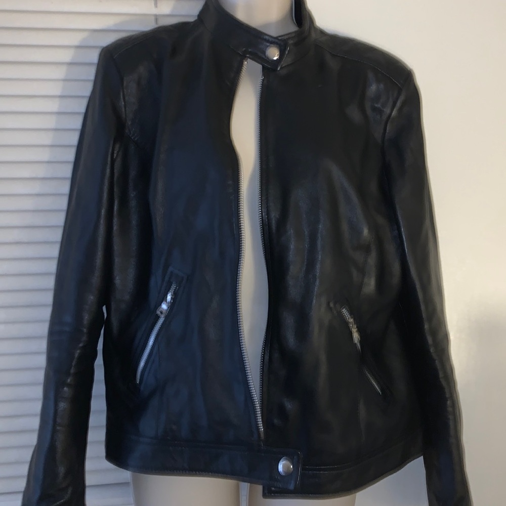 This is a black lambskin moto leather jacket. Brand new with tags.